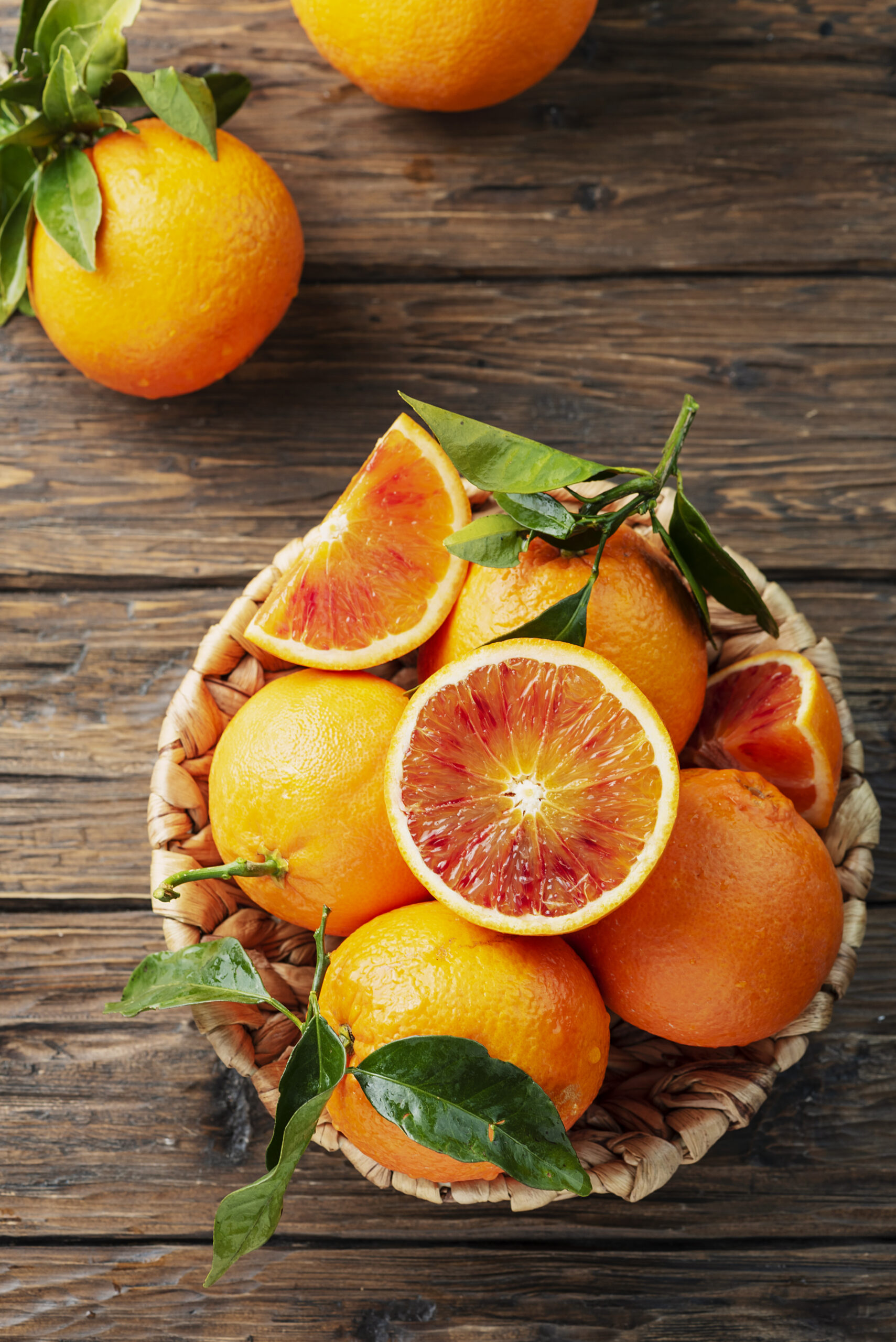 Sweet red oranges of Sicily in the basket, rustic style and selective focus
